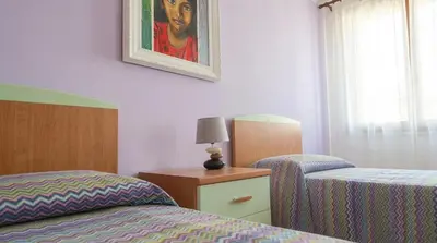 Letto o letti in una camera di Casa sul Cielo di Burano