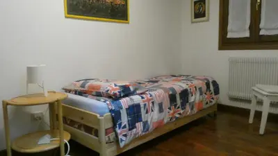 Letto o letti in una camera di Mamma Mia on ground floor with private parking TV-VENICE