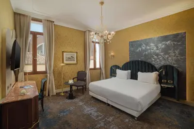 Letto o letti in una camera di NH Venezia Santa Lucia