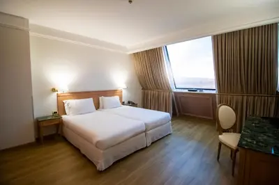 Letto o letti in una camera di SHG Hotel De La Ville