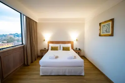 Letto o letti in una camera di SHG Hotel De La Ville