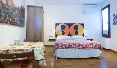 Letto o letti in una camera di Ai Tagliapietra