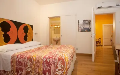Letto o letti in una camera di Ai Tagliapietra