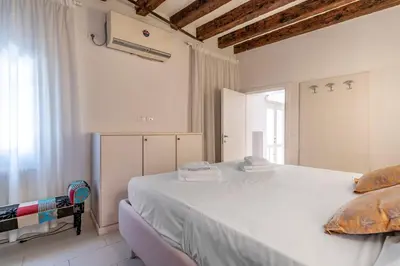 Letto o letti in una camera di Cà Fontana