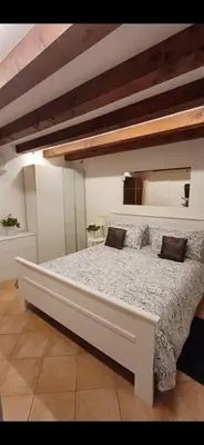 Letto o letti in una camera di Fiore della Laguna