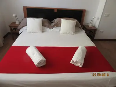 Letto o letti in una camera di Il Sole