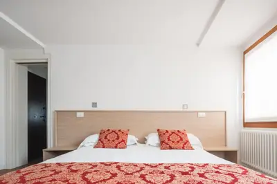 Letto o letti in una camera di Goodwind Venice Apartments