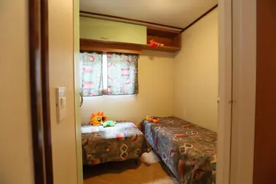 Letto o letti in una camera di Village Camping Joker