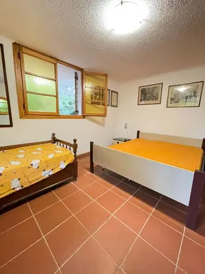 Letto o letti in una camera di VILLA CA' SILVA - WALTERIGATO Apartments SOLO PER FAMIGLIE