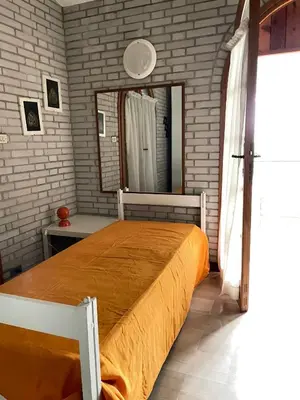 Letto o letti in una camera di VILLA CA' SILVA - WALTERIGATO Apartments SOLO PER FAMIGLIE