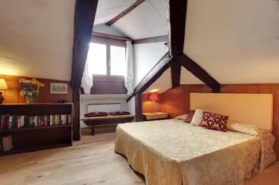 Letto o letti in una camera di Ca' Badoer Attic