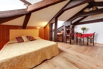 Letto o letti in una camera di Ca' Badoer Attic
