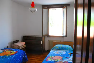 Letto o letti in una camera di Casa Vacanze Vedelago