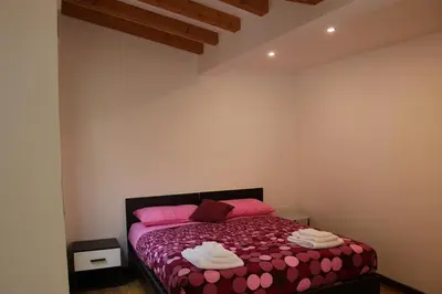 Letto o letti in una camera di Alessandra House