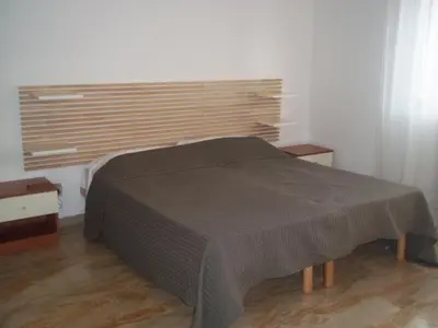 Letto o letti in una camera di Appartamento Gronda Lagunare