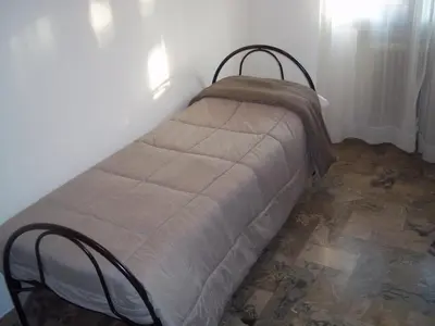 Letto o letti in una camera di Appartamento Gronda Lagunare