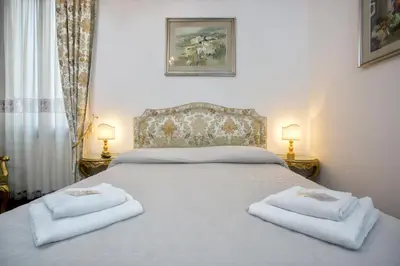 Letto o letti in una camera di Residenza Calle Larga San Marco