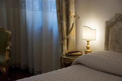 Letto o letti in una camera di Residenza Calle Larga San Marco