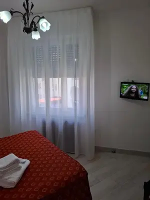 Letto o letti in una camera di Le Maschere