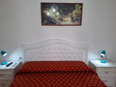 Letto o letti in una camera di Le Maschere