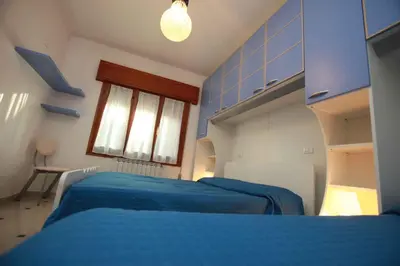 Letto o letti in una camera di Two-Bedroom Apartment in Rosolina Mare 25037