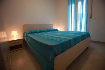 Letto o letti in una camera di Apartments in Rosolina Mare 25008