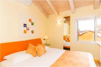 Letto o letti in una camera di Casa Nova