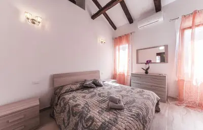 Letto o letti in una camera di Ca' Laura - Murano Centro - 10 min from Venice