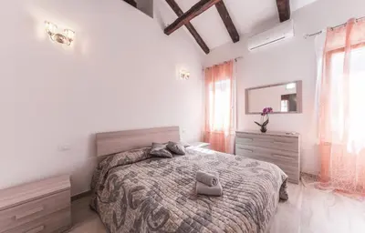 Letto o letti in una camera di Ca' Laura - Murano Centro - 10 min from Venice