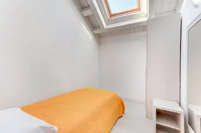 Letto o letti in una camera di Residence La Fontaine