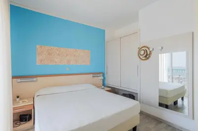 Letto o letti in una camera di Hotel La Brezza frontemare