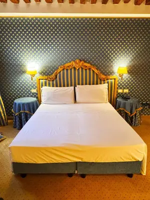 Letto o letti in una camera di Hotel Corte Contarina