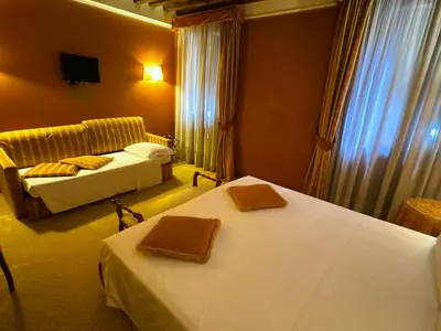 Letto o letti in una camera di Hotel Corte Contarina