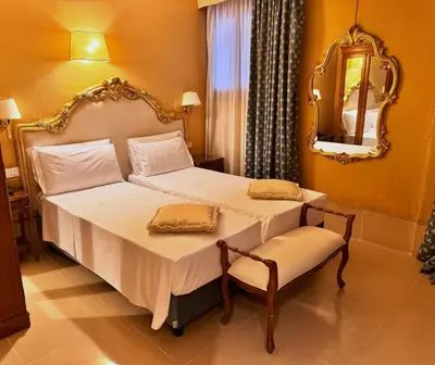 Letto o letti in una camera di Hotel Corte Contarina