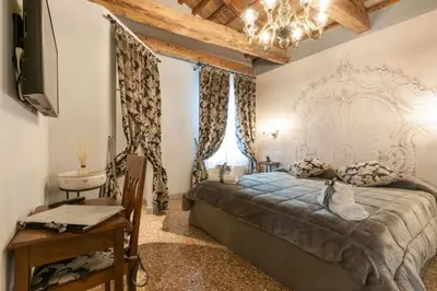 Letto o letti in una camera di San Marco Luxury Apartment - Muneghe