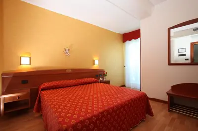 Letto o letti in una camera di Hotel Helios