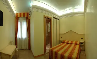 Letto o letti in una camera di Locanda Zabotto