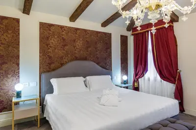 Letto o letti in una camera di Hotel Palazzina Sardi