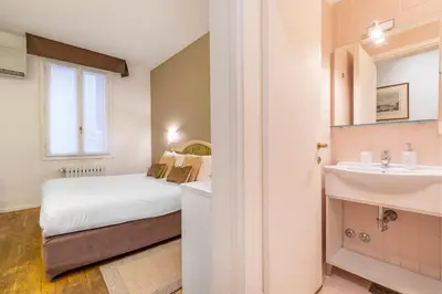 Letto o letti in una camera di Hotel Casa Petrarca