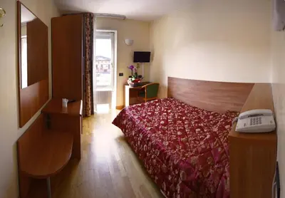 Letto o letti in una camera di Hotel Brennero
