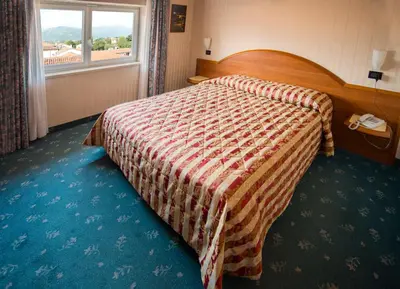 Letto o letti in una camera di Hotel Brennero