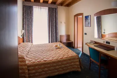 Letto o letti in una camera di Hotel Brennero