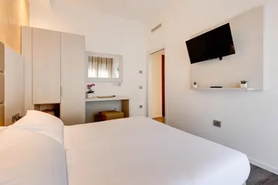 Letto o letti in una camera di Hotel Piccadilly