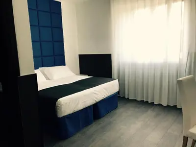 Letto o letti in una camera di Hotel Pex Padova