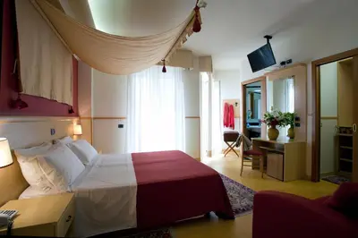 Letto o letti in una camera di Hotels Vidi Miramare & Delfino