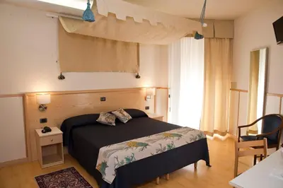 Letto o letti in una camera di Hotels Vidi Miramare & Delfino