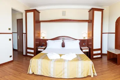 Letto o letti in una camera di Hotels Vidi Miramare & Delfino