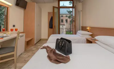 Letto o letti in una camera di Hotel Casa Del Pellegrino