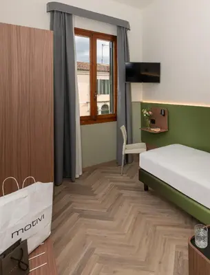 Letto o letti in una camera di Hotel Casa Del Pellegrino