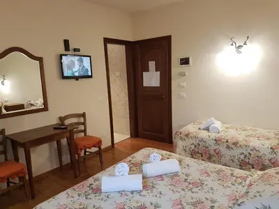 Letto o letti in una camera di Hotel Il Casolare